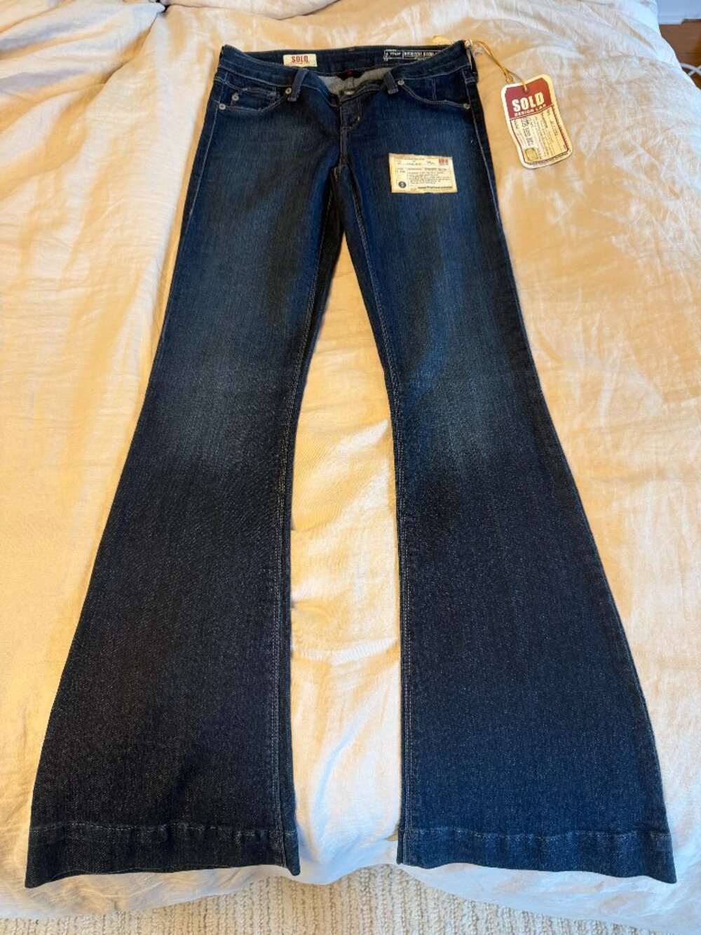 Sold Design Lab "Houston high heel bell" pull on jean, size small, dark blue